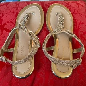 Gold sandals size 7 medium. Worn a couple of times.